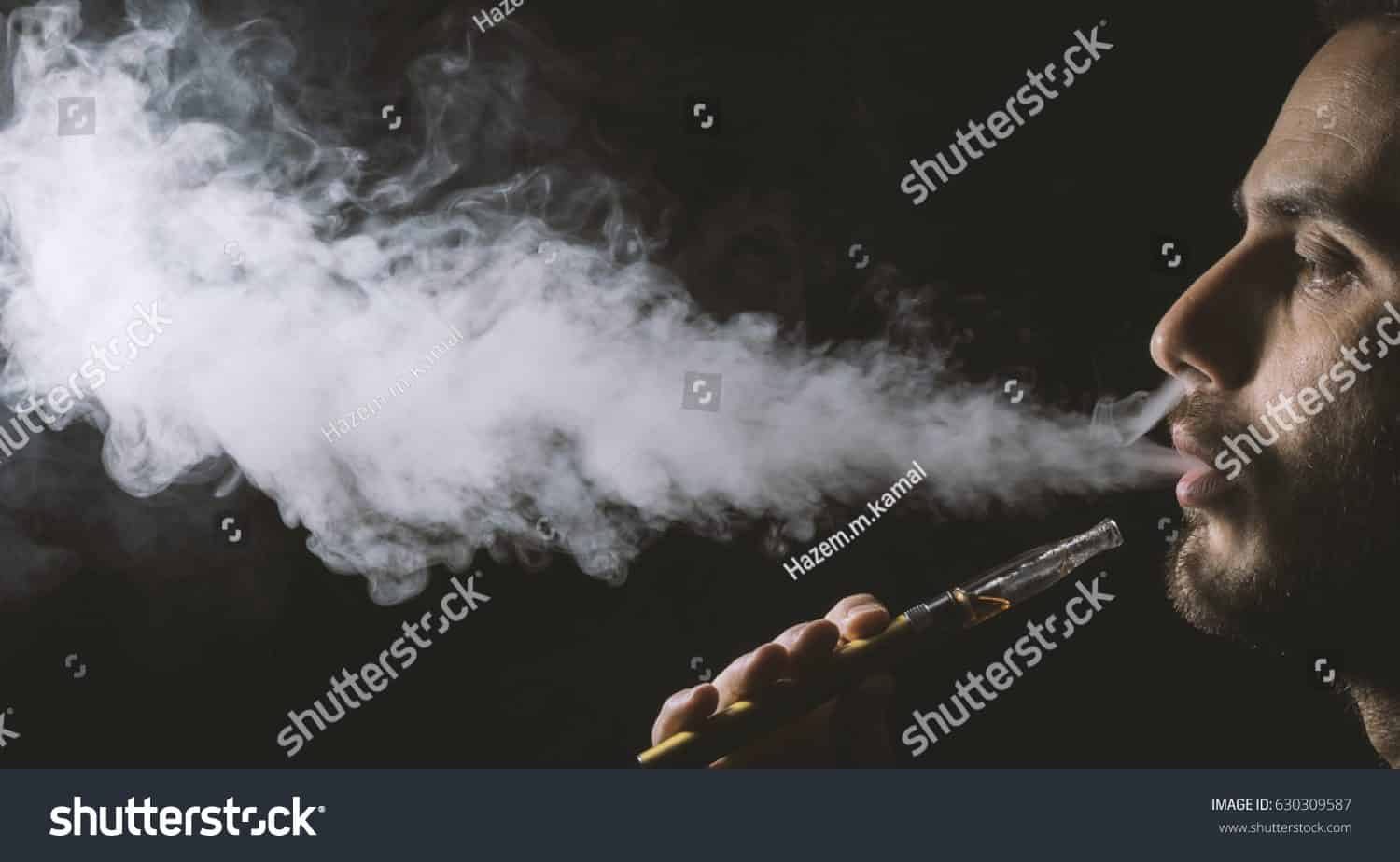 Vape in use with vapor cloud, emphasizing mood-enhancing terpenes for a romantic experience.